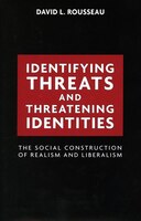 Identifying Threats And Threatening Identities: The Social Construction Of Realism And Liberalism
