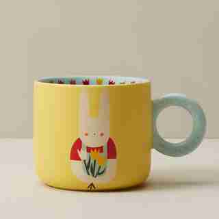 RABBIT HOLDING TULIPS MUG WITH POLKA DOT HANDLE